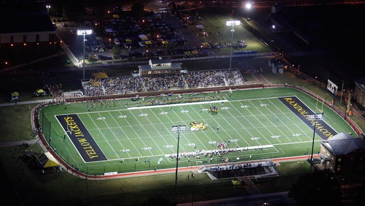 Aerial shot of the Yellow Jacket's football field at night during a game